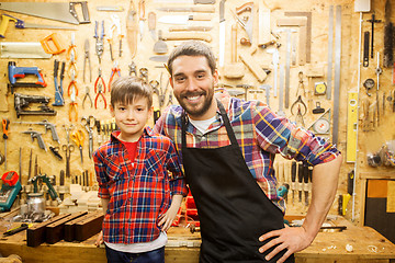 Image showing happy father and little son workshop