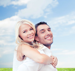 Image showing happy couple having fun over poppy flowers field