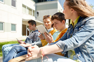 Image showing friends or students with tablet pc outdoors