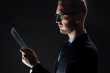 Image showing close up of businessman with transparent tablet pc