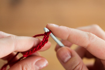 Image showing close up of hands knitting with crochet hook