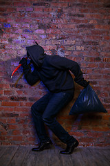 Image showing Robber with bag ,lock pick