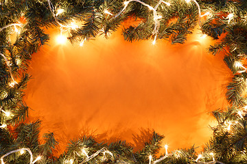 Image showing Fir branches on orange background