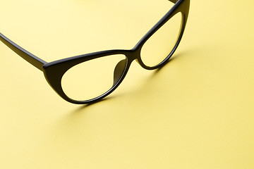 Image showing Black eyeglasses with transparent lenses