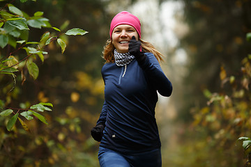 Image showing Cheerful blonde runs in morning