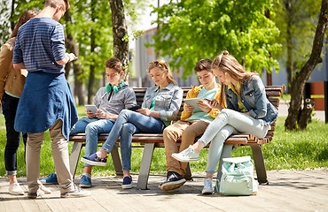 Image showing teenage students with tablet pc at school yard