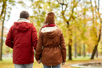 Image showing happy young couple walking in autumn park