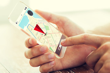 Image showing close up of hand with navigator map on smartphone