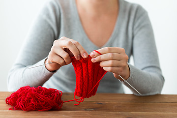 Image showing woman hands knitting with needles and yarn