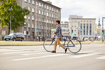 Image showing young man with fixed gear bicycle on crosswalk