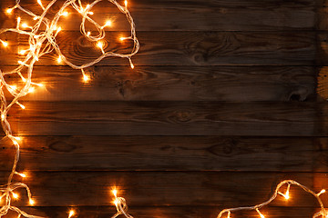 Image showing Garland on brown wooden background