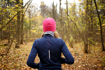 Image showing Blonde girl jogging in morning