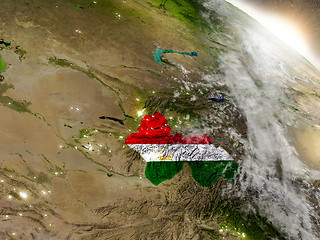 Image showing Tajikistan with flag in rising sun