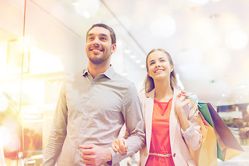 Image showing happy young couple with shopping bags in mall