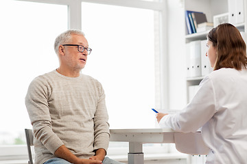 Image showing senior man and doctor meeting at hospital