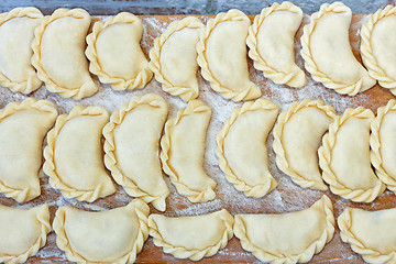 Image showing Dumplings on the kitchen board with flour