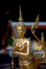 Image showing Gold praying statue