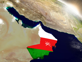 Image showing Oman with flag in rising sun