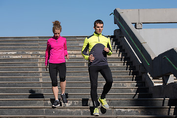 Image showing young  couple jogging on steps