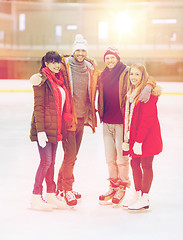 Image showing happy friends on skating rink