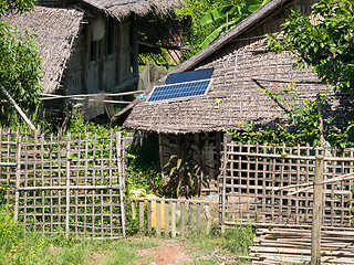 Image showing Straw house with solar panel