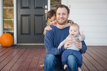 Image showing Mixed Race Father and Sons on Front Porch