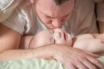 Image showing Mixed Race Chinese and Caucasian Baby Boy Laying In Bed with His