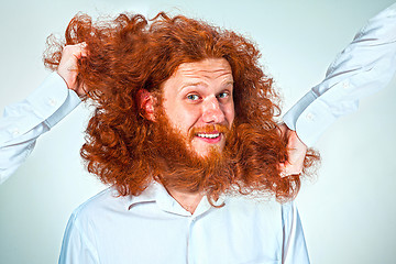 Image showing The Angry man tearing his hair