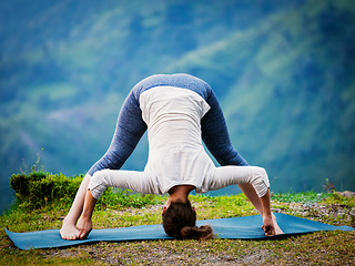 Image showing Woman doing Ashtanga Vinyasa Yoga asana Prasarita padottanasana 