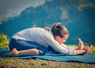 Image showing Woman in Tiryam-Mukha Eka-Pada Paschimottanasana asana stretchin