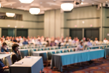 Image showing Blured image of audience in conference hall attending business conference.