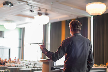 Image showing Public speaker giving talk at business event.