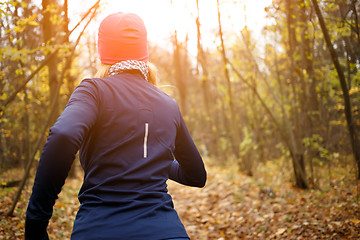Image showing Blonde sportswoman jogging in morning