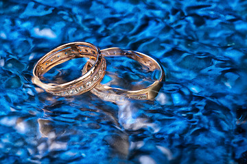 Image showing Golden Rings In The Water