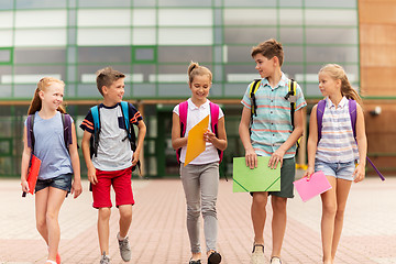 Image showing group of happy elementary school students walking