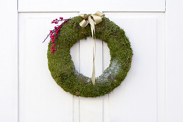 Image showing Advent Christmas wreath on white door decoration