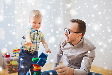 Image showing father and son playing with toy blocks at home