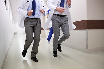 Image showing close up of medics or doctors running at hospital