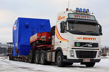 Image showing White Volvo FH16 Semi Oversize Load Transport in Winter