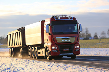 Image showing Red MAN Sugar Beet Transport Truck on Early Winter Road