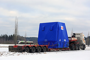 Image showing Side view of Semi Truck Oversize Load Parked