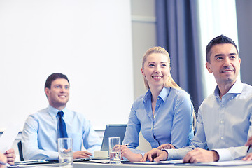 Image showing group of smiling businesspeople meeting in office