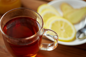 Image showing tea cup with lemon and ginger on plate