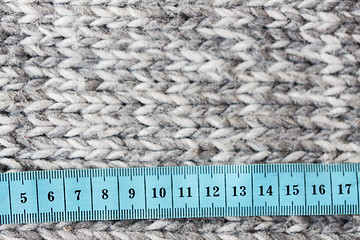 Image showing close up of knitted item with measuring tape