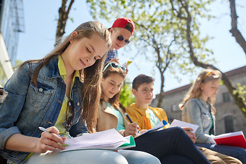 Image showing group of students with notebooks at school yard