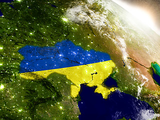 Image showing Ukraine with flag in rising sun