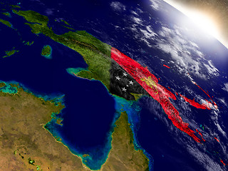 Image showing Papua New Guinea with flag in rising sun