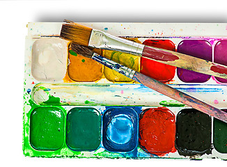 Image showing Closeup of watercolor paints set and brushes