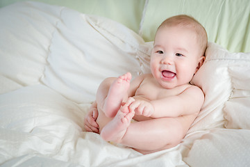 Image showing Mixed Race Baby Boy Having Fun on His Blanket