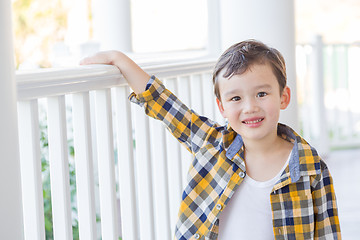 Image showing Young Mixed Race Boy on His Front Porch